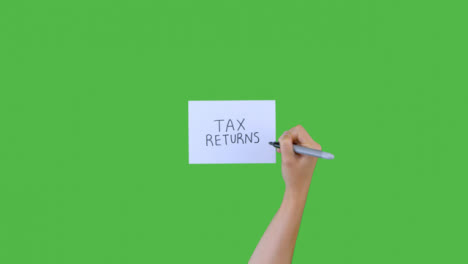 Woman-Writing-Tax-Returns-on-Paper-with-Green-Screen-02